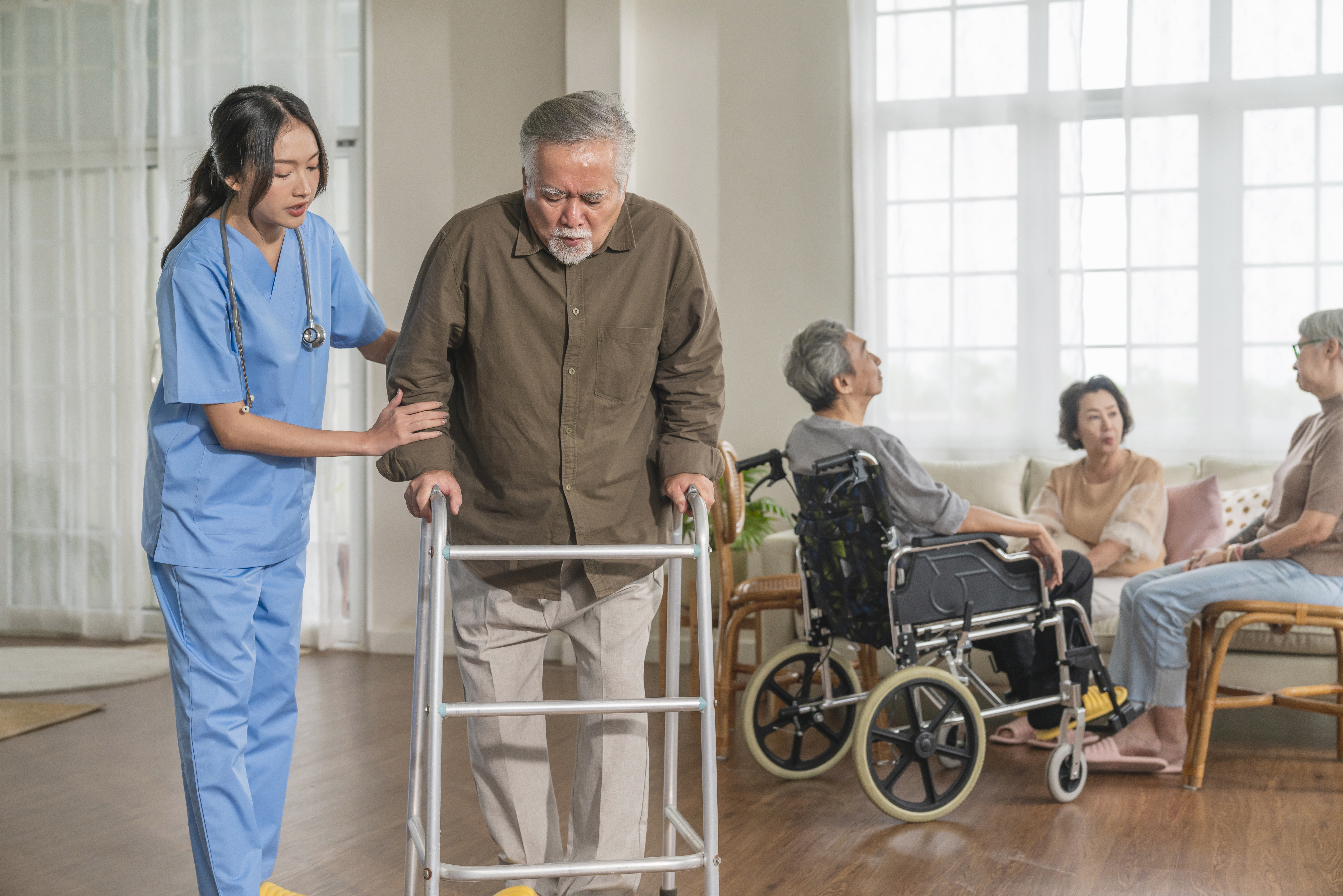 Caregiver helping elderly patient