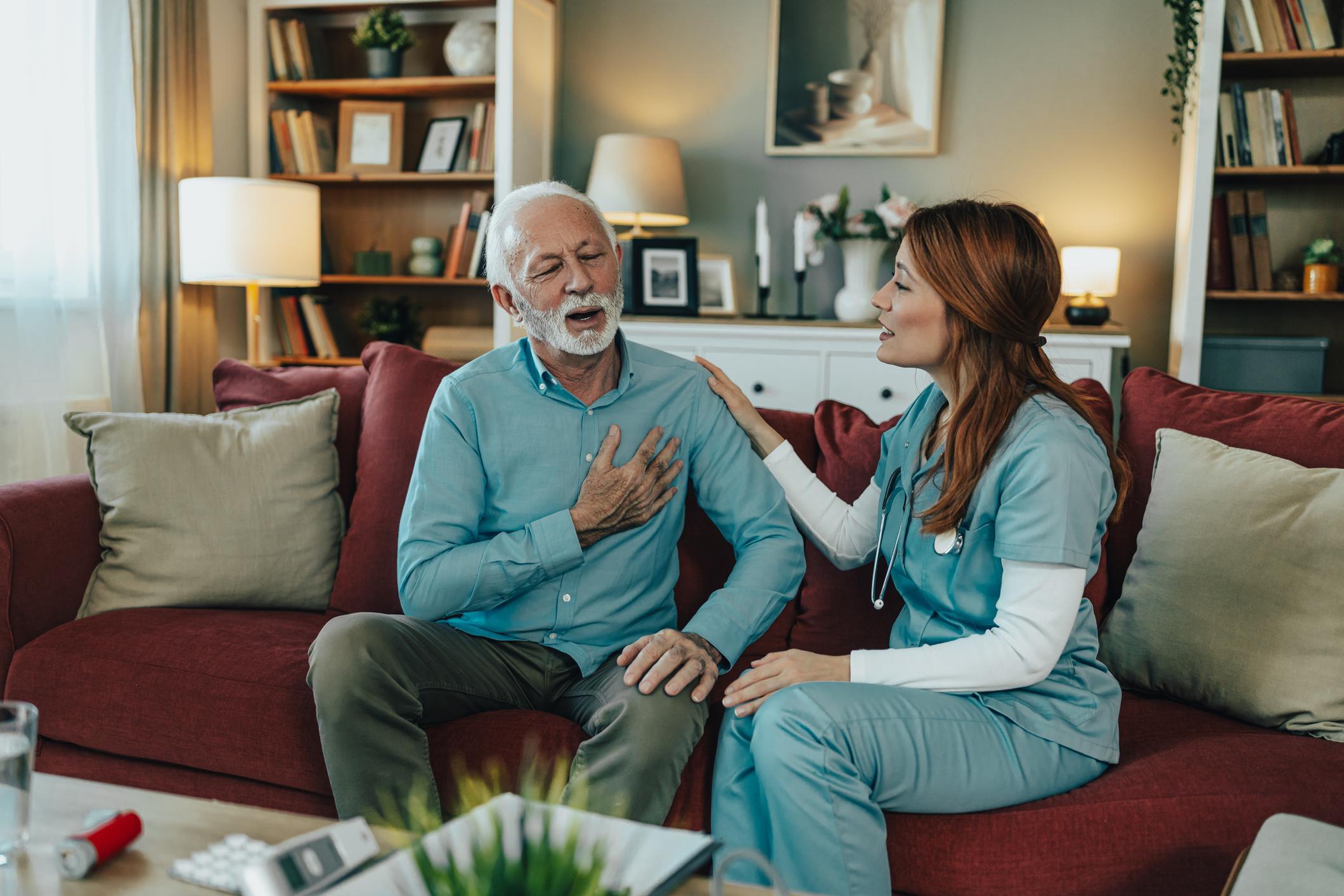 Caregiver supporting an older adult at home